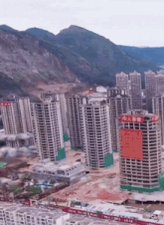 The image shows an aerial view of a city with several tall buildings under construction, indicating that there might be a financial crisis or economic downturn affecting the area. The post suggests that Bitcoin could be affected by this situation, possibly causing a significant drop in its value. This is because the post implies that the market collapse will lead to a "black swan event," which refers to an unexpected and severe economic crisis. The image also includes a red square with white text on it, but without more context or information about what the square says, we cannot determine its significance within the broader context of the post.