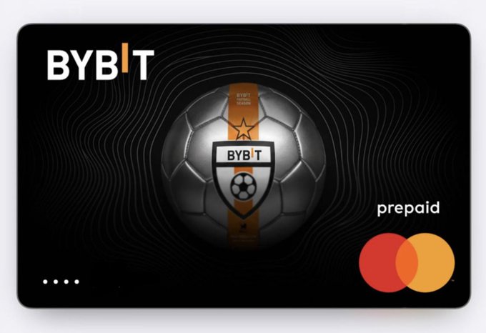A black Bybit prepaid Mastercard featuring a soccer ball with the Bybit Football Season logo and Mastercard branding, visually representing the crypto card mentioned in the post that allows direct USDT payments, Apple Pay integration, and 2%+ cashback rewards.