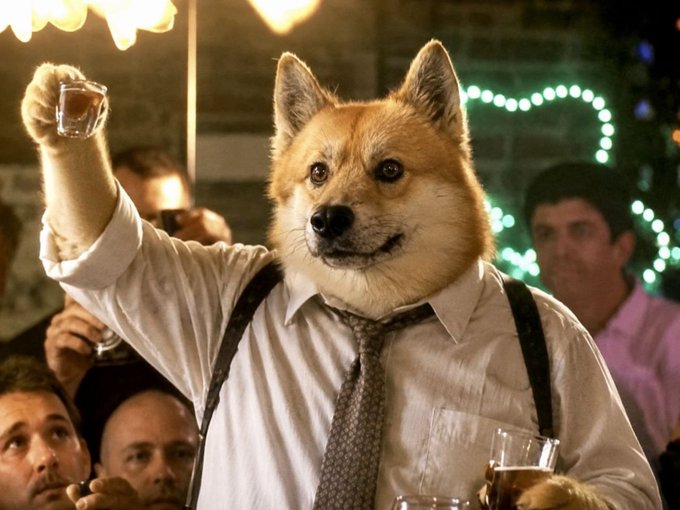 A Shiba Inu dog is digitally edited to appear wearing a white dress shirt and tie while raising a paw with a shot glass at a lively gathering with string lights in the background.
