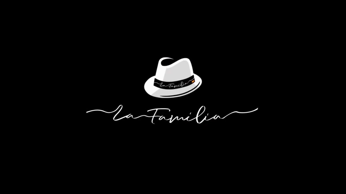 A minimalist black logo featuring a white fedora hat with 'la Familia' written on the band, above the cursive script 'la Familia'.