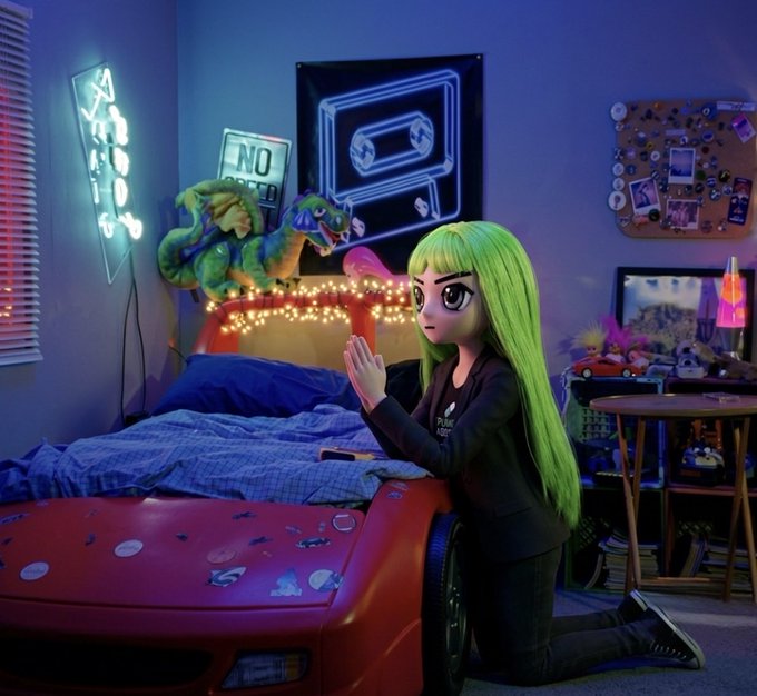 A 3D animated scene of a green-haired girl kneeling on the floor beside a bed shaped like a red race car in a neon-lit bedroom, with a dinosaur plush on the bed and neon signs on the wall.