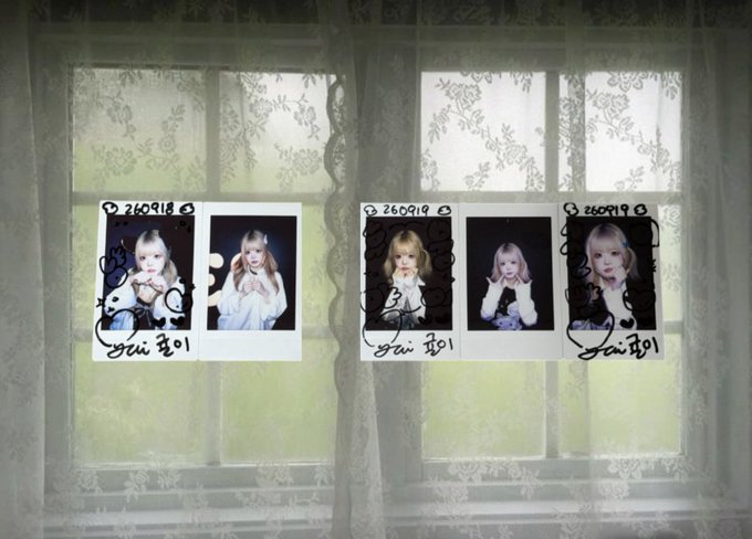 Three pairs of Polaroid-style photo strips are taped to a window with white lace curtains. The photos feature a blonde woman in various poses, with handwritten text and dates including '260918' and '260919'.