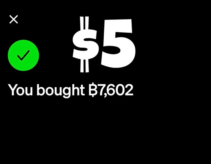 A confirmation screen showing a $5 purchase of ₿7,602 with a green checkmark on a black background.