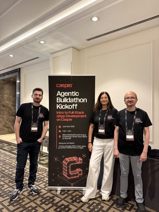 The image shows three people standing next to a banner that says "Casper Agentic Buildathon Kicked Off Istanbul at @IstanbulBlockWk with a hands-on developer workshop!". The group consists of two men wearing black t-shirts, one man in white pants and another man in gray pants. They are all smiling for the camera.