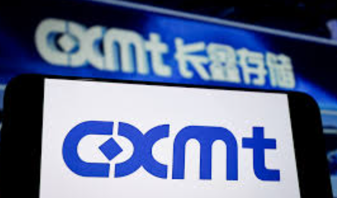 A close-up of a smartphone displays the 'cxmt' logo on its screen, with a matching 'cxmt' sign and Chinese characters visible in the blurred background.