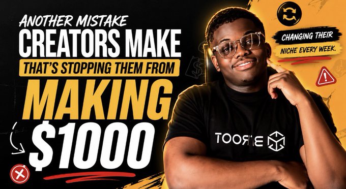 A YouTube-style thumbnail showing a smiling young man in glasses and a black 'TOOSHE' shirt, with text reading 'ANOTHER MISTAKE CREATORS MAKE THAT'S STOPPING THEM FROM MAKING $1000' and a warning that creators are 'CHANGING THEIR NICHE EVERY WEEK'.