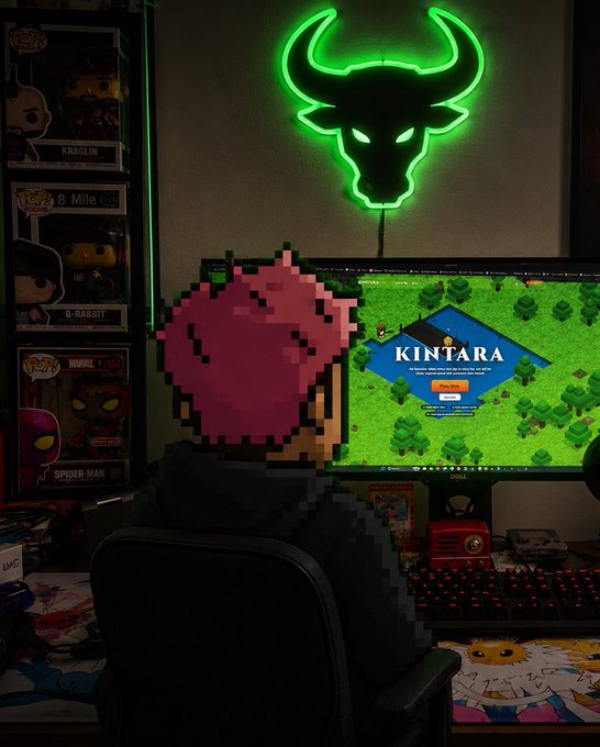 A person with a pixelated Mario heart head sits at a gaming setup featuring a green neon bull sign, Funko Pop collectibles (Kraglin, B-Rabbit, Spider-Man), and a monitor displaying the "KINTARA" game website, illustrating the post's "Rise and grind players" gaming motivation.