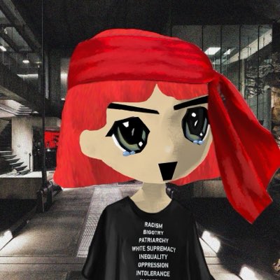 An anime-style character with bright red hair and a red bandana cries blue tears while wearing a black shirt listing social issues including 'RACISM', 'BIGOTRY', and 'OPPRESSION'.
