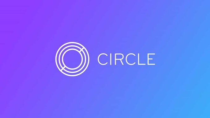 The image displays the Circle logo—two overlapping white circular outlines—next to the word "CIRCLE" in clean white text, set against a vibrant purple-to-blue gradient background. This visual corresponds to the post's announcement of Circle, the stablecoin issuer behind USDC, receiving approval to operate as a U.S. national trust bank, highlighting its transition from crypto disruptor to regulated banking entity.