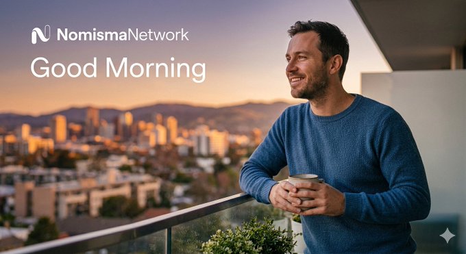 The image shows an advertisement featuring a man standing on his balcony at sunrise holding a coffee cup while looking out over the city skyline. The man appears to be enjoying a moment of tranquility before starting his day, as suggested by the phrase "Good Morning" in the background of the advertisement. The focus is on the man and the beautiful backdrop of the city's skyline, creating a sense of serenity and connection with nature.