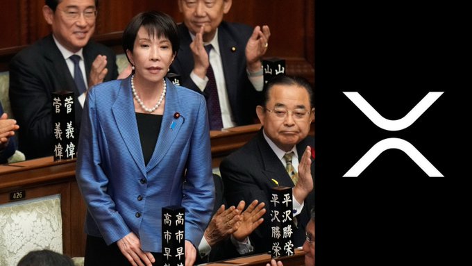In this image, Japanese politicians are shown clapping in the background, beside the prominent white XRP logo on a black background. This image connects to the post's claims about Japan integrating XRP into its financial system with Shinsei Bank.