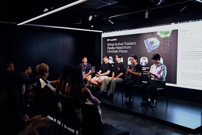 A panel of six speakers sits on stage in a darkened room at the Onchain Trading Forum during WebX week, with a large screen behind them displaying "What Active Traders Really Need from Onchain Perps" alongside the PayDEX logo. Audience members are seated in the foreground watching the discussion, consistent with the post's description of a packed forum covering liquidity and market structure for Perp DEXs.