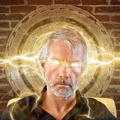 A digitally edited image shows a man with glowing orange lightning emanating from his eyes, set against a brick wall background with a large golden Bitcoin symbol behind his head, visually representing Michael Saylor's "orange" reference to Bitcoin purchases by Strategy.