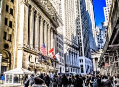 A bustling street scene in front of the New York Stock Exchange, where the iconic neoclassical facade is visible amid crowds of people and skyscrapers under a bright blue sky, contextualizing the financial market activity referenced in the post about the $1T stock selloff and its implications for Bitcoin ($BTC), Meta ($META), and Microsoft ($MSFT).