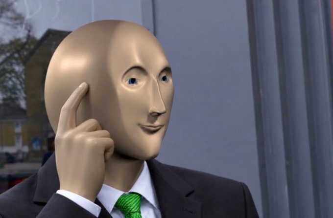 A 3D animated figure with a mannequin-like face wearing a black suit and green tie, posing with one finger to its temple.