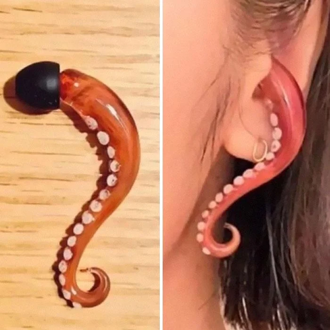 A side-by-side comparison showing an orange, tentacle-shaped object with suction cups and a black tip on the left, and a similar design worn as a fake ear/earring accessory on a person on the right.