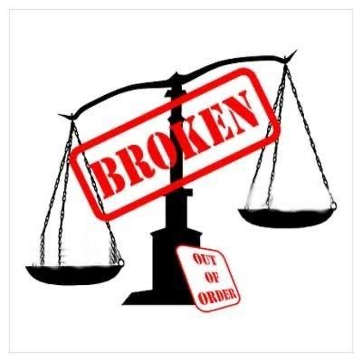 A black and white graphic of a broken scale of justice with a red 'BROKEN' stamp across it and an 'OUT OF ORDER' sign attached.