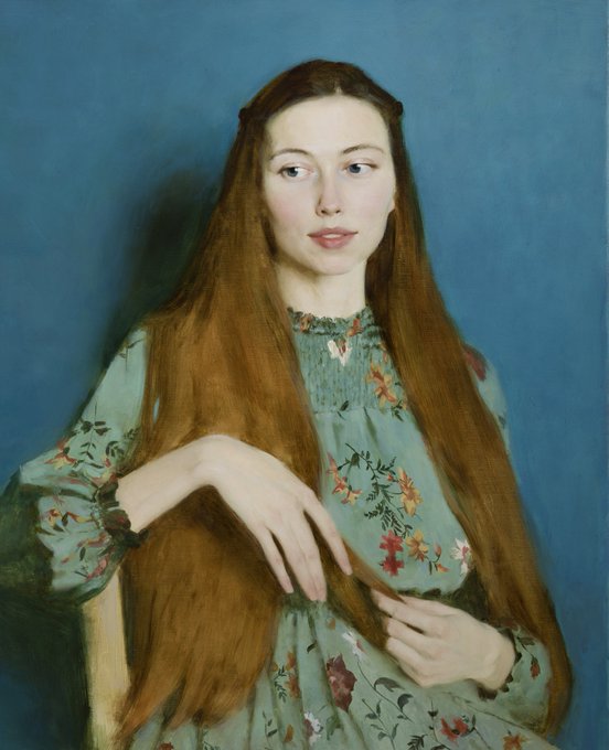 A painted portrait of a young woman with long auburn hair, wearing a green floral dress, gently holding strands of her hair against a blue background. The painting is rendered in a classical realist style.
