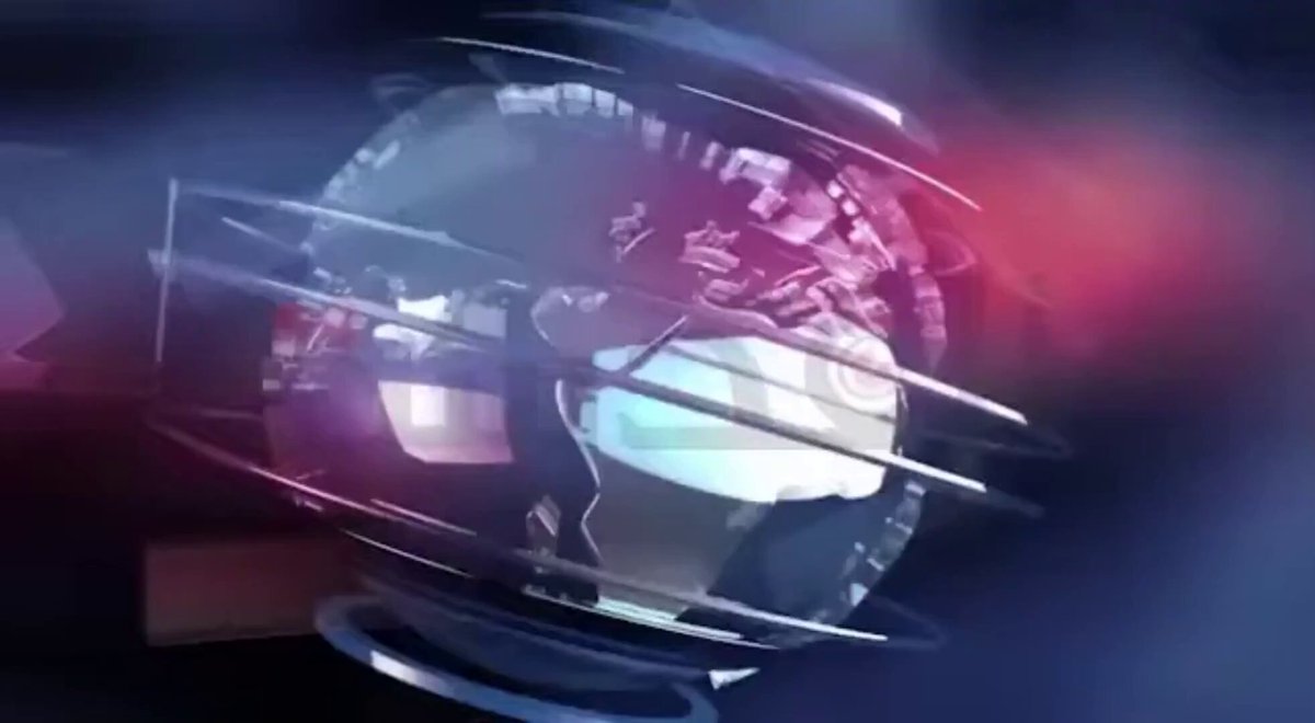 The image features a globe that has been edited to appear as if it's spinning around. The globe is surrounded by a black background with red and blue colors, giving it a futuristic appearance. In the bottom right corner of the image, there are some text elements related to Bitcoin and cryptocurrency news articles.