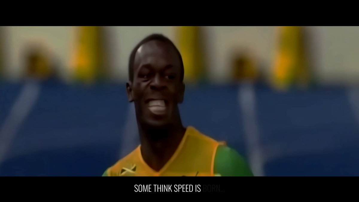 The image features a man wearing a yellow shirt with "speed" written across his chest, smiling at the camera. The background of the image shows a stadium filled with people watching a sports event or game. There are also two other people visible in the background who appear to be playing soccer. The caption below the image reads: "This is what Cardano DeFi needs".