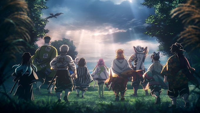 An anime-style illustration showing characters from Demon Slayer (including characters with patterned haori and a bird companion) standing together in a grassy field, viewed from behind as they look toward a dramatic sunset sky with a bird flying overhead.