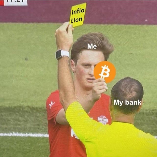 A meme showing a soccer referee showing a yellow 'inflation' card to a player labeled 'Me', while the referee holds a Bitcoin coin labeled 'My bank'.