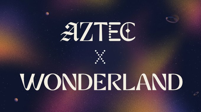 The image features a poster for Aztec and Wonderland collaborating on a project. The poster displays the text "Aztec" and "Wonderland" written in white, with the words "x" and "Wonderland" below them. The background of the poster is a dark blue color, which contrasts with the white text. The image also includes a small illustration of planets, adding to the overall visual appeal of the poster.