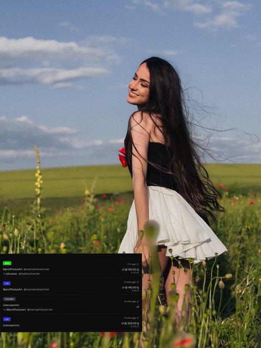 The image features a woman wearing a white skirt, standing in a field with her hair blowing in the wind. She has a smile on her face as she looks at the camera. The photo was taken by someone named @Marinphotosart, who is known for their talent in capturing beautiful moments and sharing them online. 

The image also contains text that reads "A beautiful secondary market moment SOUL SMILES has found a new home with dear BiG. Heartfelt thanks to the first collector @Marinphotosart and to dear @_bitcoiner for their trust." This message is from another person who contributed to the photo, expressing gratitude towards both @Marinphotosart and @_bitcoiner for sharing the image on social media platforms.