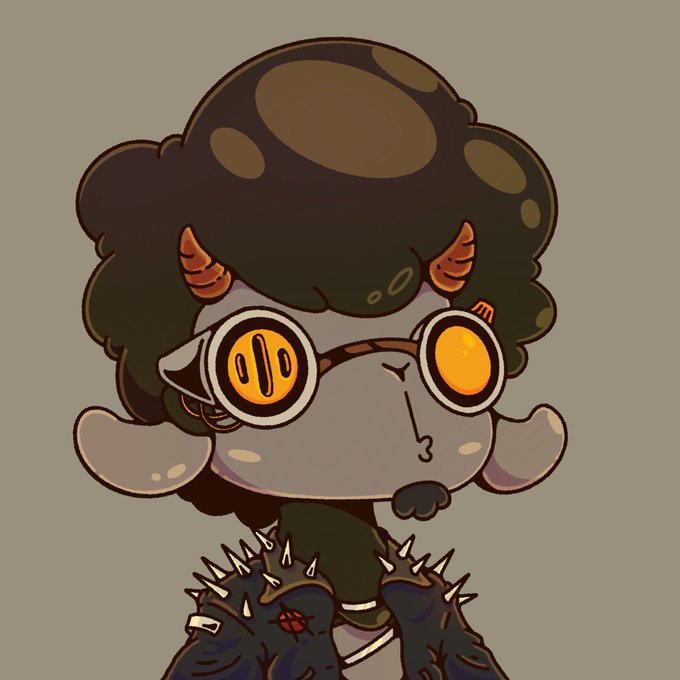 A stylized cartoon illustration of a character with dark skin, large round yellow goggles, dark curly hair, and spiked gauntlets.