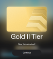 A gold 'Gold II Tier' badge or membership card with a 'Continue' button beneath it.