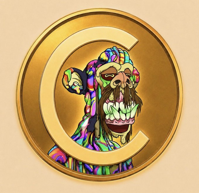 A gold coin featuring a colorful cartoon monkey with a large grinning mouth and prominent teeth, set against a beige background.