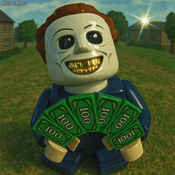 A toy figure with a grinning face holds up five green 100-buck bills in a grassy suburban setting, humorously referencing the post's hopeful wish for $ANSEM to reach $0.9.