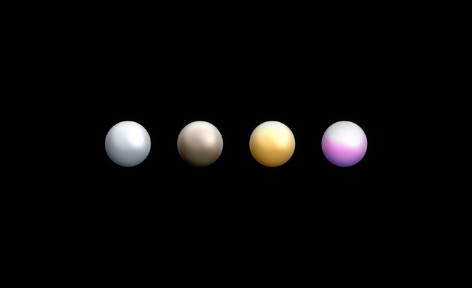Four colorful spheres in a row against a black background, colored light blue, brown/tan, yellow/gold, and pink/lavender from left to right.