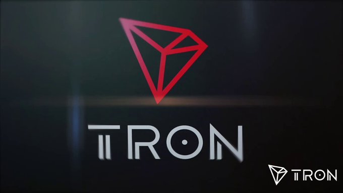 A red diamond-shaped TRON logo is displayed prominently above the word 'TRON' on a dark background.