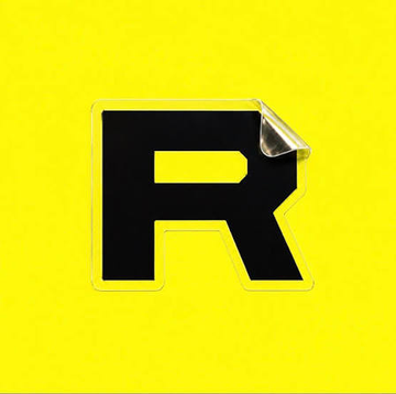 The image shows a stylized black letter "R" with a peeling sticker corner effect on a bright yellow background, serving as the Rarible logo. This visual reinforces the post's announcement about Rarible's expansion to the Solana blockchain.