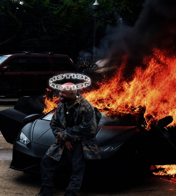 A person sitting on a matte black Lamborghini that is engulfed in flames, wearing a camouflage jacket, with a neon 'MOTION' sign glow effect above their head.