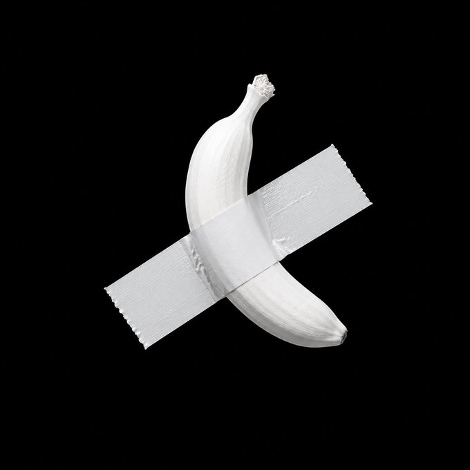 A white banana appears taped to a black background, resembling Maurizio Cattelan's famous artwork 'Comedian.'