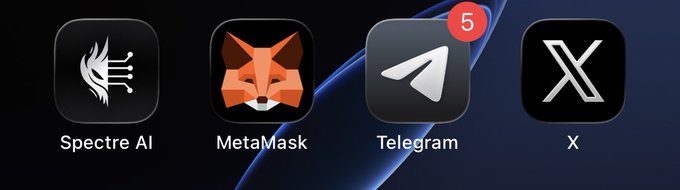 A screenshot of a phone home screen showing four app icons: Spectre AI, MetaMask, Telegram (with a notification badge showing '5'), and X.