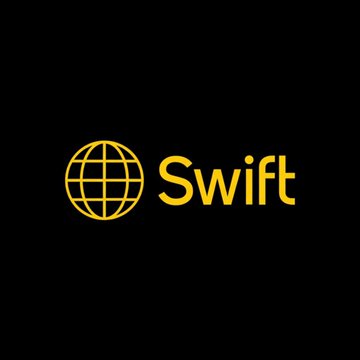 The image displays the yellow Swift logo, featuring a stylized globe icon next to the word "Swift" on a black background, representing the global financial messaging network referenced in the announcement of IBM connecting its Digital Asset Haven platform to Swift's blockchain ledger for 24/7 tokenized deposit settlements.