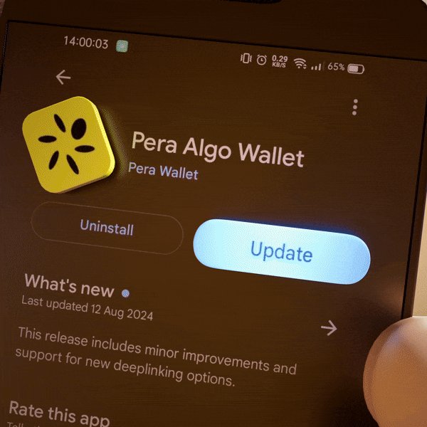The image shows a cell phone screen displaying an Android app called "Pera Algo Wallet" with a yellow icon, along with some text that reads "What's new? Last updated 12 Aug 2014 by developer". The app appears to be updating itself or has been updated recently. This information is relevant to the post because it suggests that the user might have received updates for the app or may need to update their device to take advantage of the new features in the app.