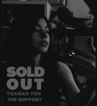 A black and white photo of a woman holding a smartphone, overlaid with the text 'SOLD OUT THANKS FOR THE SUPPORT'.