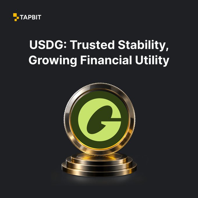 A promotional graphic for TAPBIT with the text "USDG: Trusted Stability, Growing Financial Utility" above a gold coin featuring a green 'G' logo.