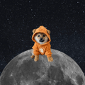 A small cartoon character wearing an orange spacesuit sitting on the moon's surface against a starry space background.