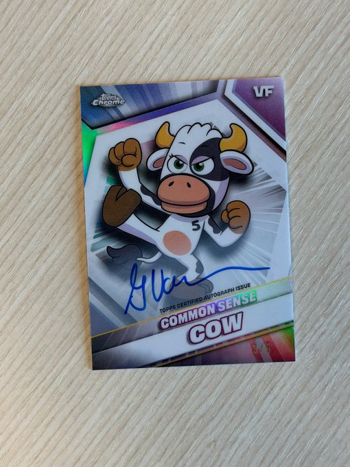 ursa common sense trading card, signed by actor and printed on a purple background with a white border.