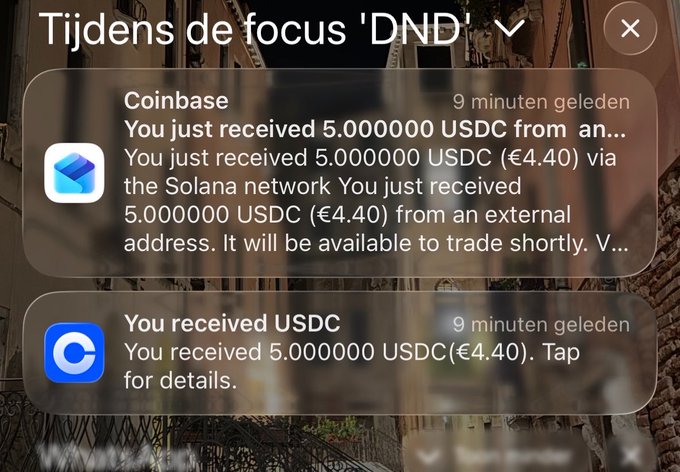 A smartphone screenshot of notifications during a 'DND' focus mode, showing two alerts about receiving 5.000000 USDC (€4.40) from Coinbase.