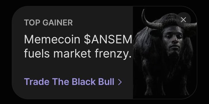 A cryptocurrency app notification showing 'TOP GAINER Memecoin $ANSEM fuels market frenzy' with a 'Trade The Black Bull' link and an image of a horned bull-headed figure.