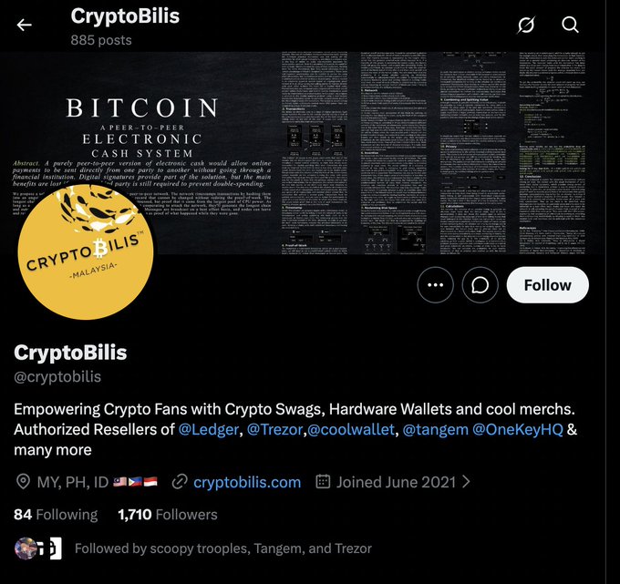 The image shows a Twitter/X profile for "CryptoBills" (@cryptobilis), a cryptocurrency merchandise and hardware wallet reseller based in Malaysia with 1,710 followers, advertising authorized reselling of Ledger, Trezor, CoolWallet, Tangem, and OneKey products. The accompanying post warns that the recent Ledger exploit (which caused over $80M in losses) traces back to users who purchased devices from this reseller, raising concerns about the security of used hardware wallets bought through secondhand channels.