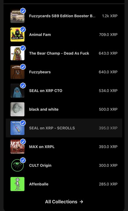 An NFT marketplace listing showing collections with their XRP prices, including Fuzzycards 589 Edition Booster B... at 1.2k XRP, Animal Fam at 709.0 XRP, The Bear Champ - Dead As Fuck at 643.0 XRP, and SEAL on XRP - SCROLLS at 395.0 XRP (highlighted).
