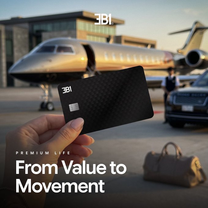 Promotional image for JB1 showing a hand holding a black premium card in front of a private jet, with the tagline "PREMIUM LIFE - From Value to Movement."