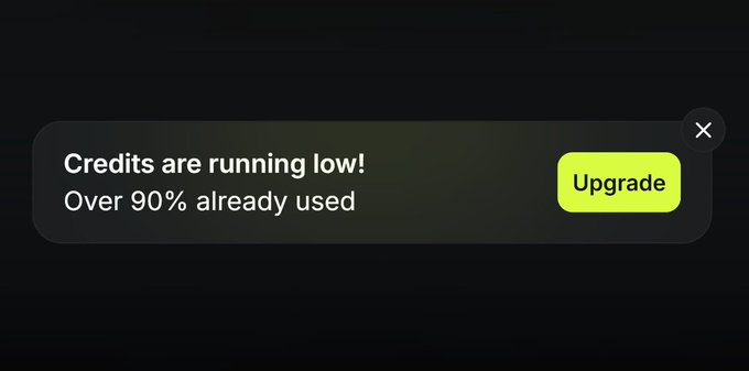 A dark notification banner with white text reading 'Credits are running low! Over 90% already used' alongside a bright green 'Upgrade' button.